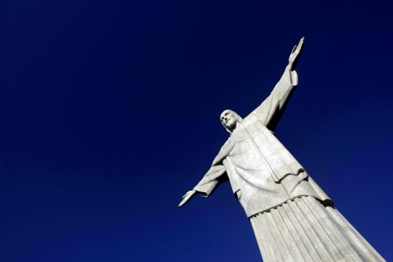 The statue of "Christ the Redeemer" is seen atop scenic Corcovado mountain during a restoration ceremony in Rio de Janeiro June, 30, 2010. The famous statue of Christ with his arms wide open that "cariocas" and tourists are used to seeing from various points has been covered up the last four months by 89 tons of scaffolding. REUTERS/Bruno Domingos (BRAZIL - Tags: SOCIETY RELIGION TRAVEL) - RTR2FY2E